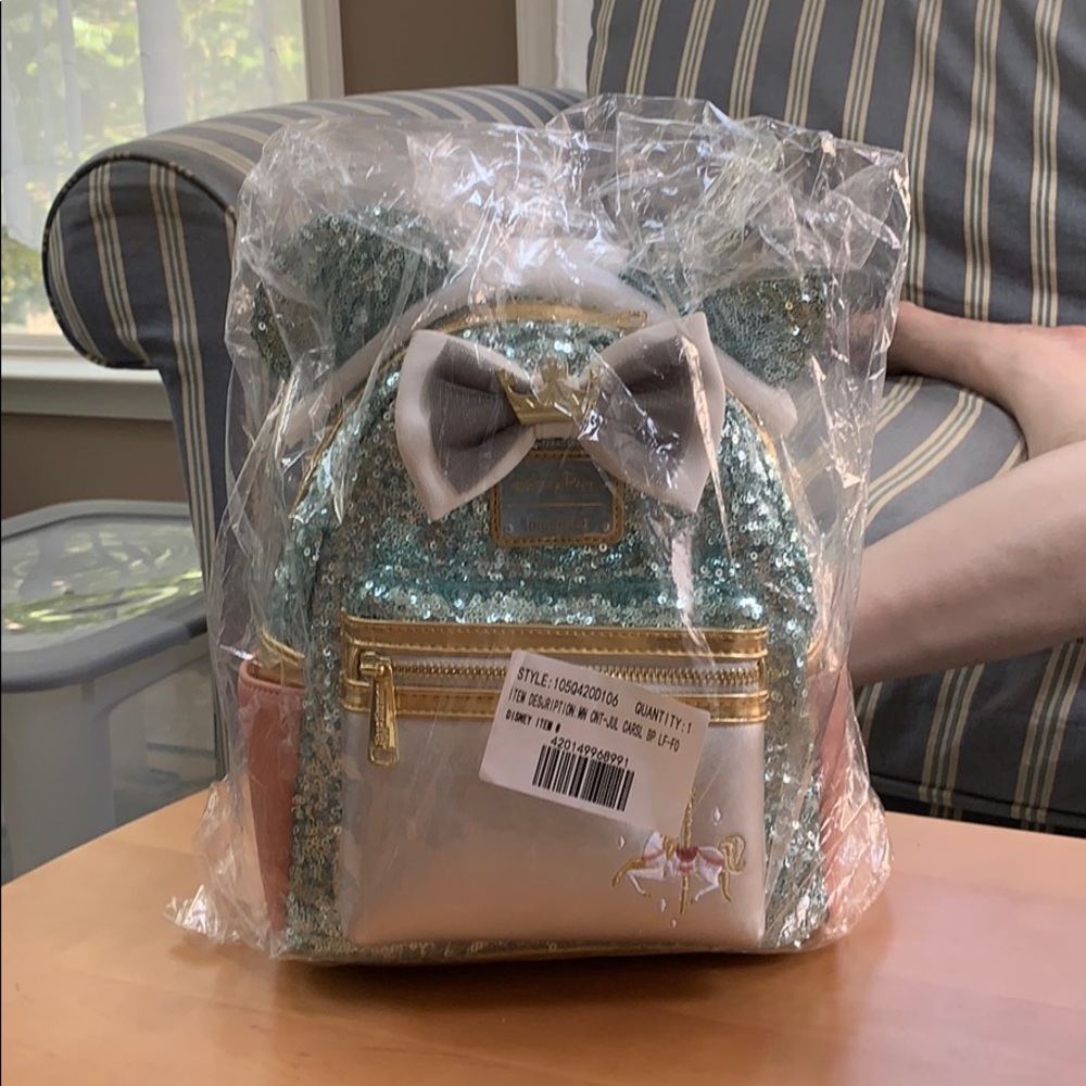 Loungefly Disney’s Main Attraction July backpack